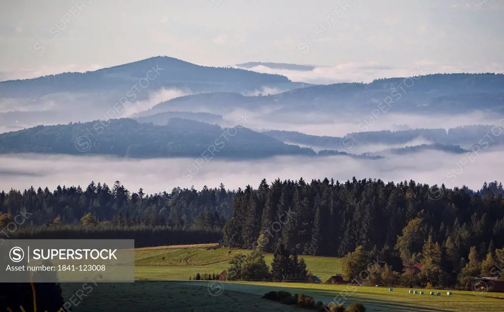 Morning fog above the Bavarian Forest near Altreichenau, Germany