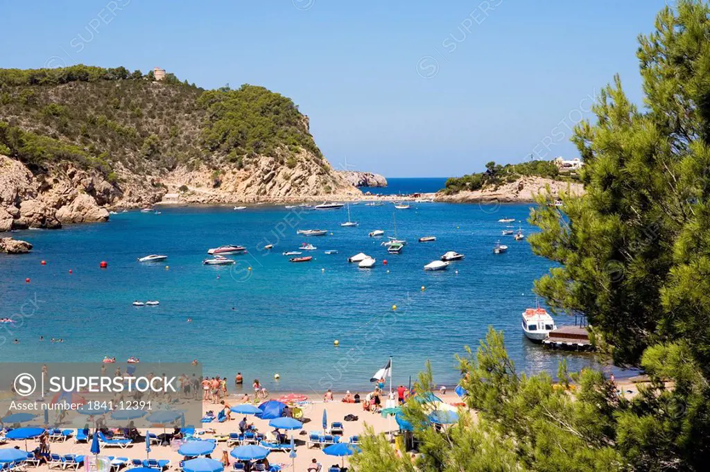 Tourists on the beach of Puerto de San Miguel, Ibiza, Spain, elevated view