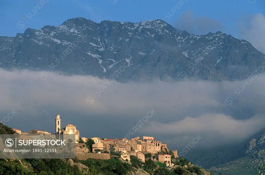 Aerial view of town on mountain at dusk, Balagne, France