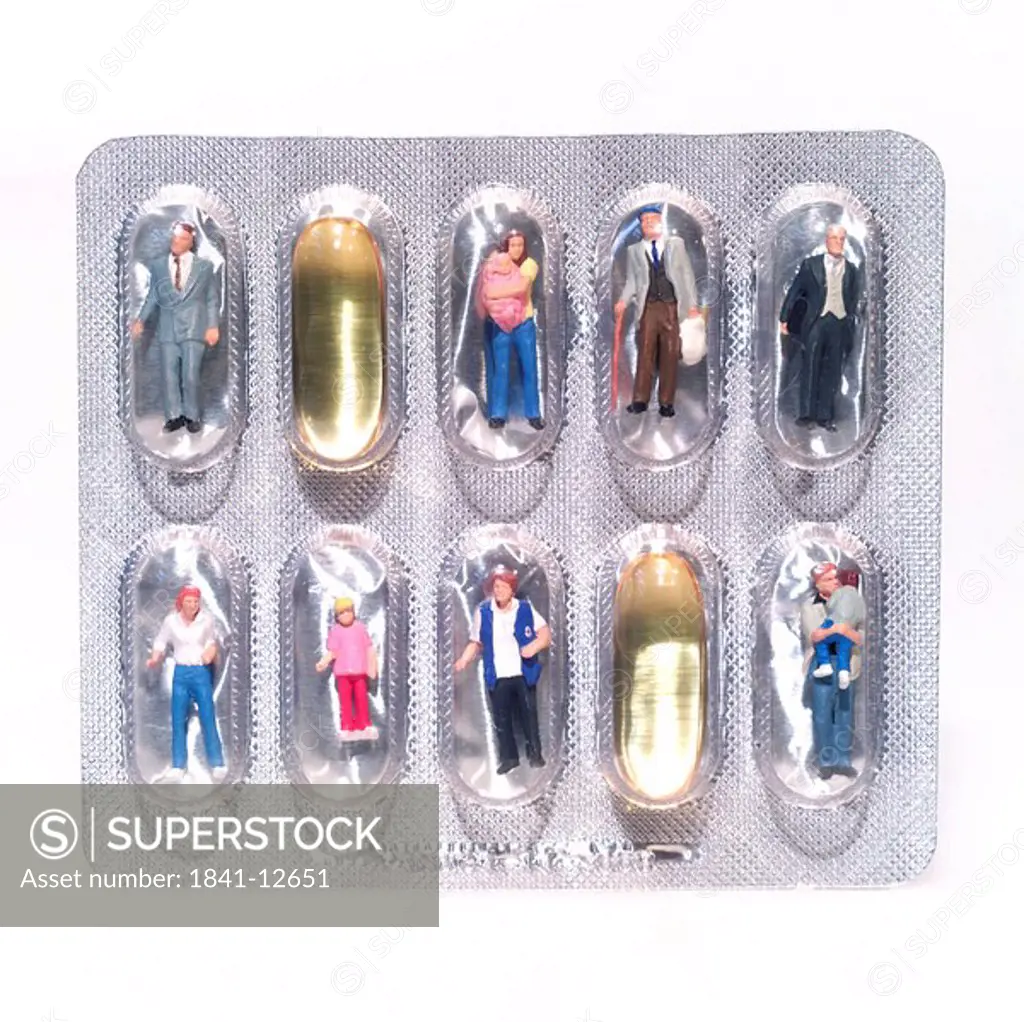 Close_up of figurines and capsules in blister pack