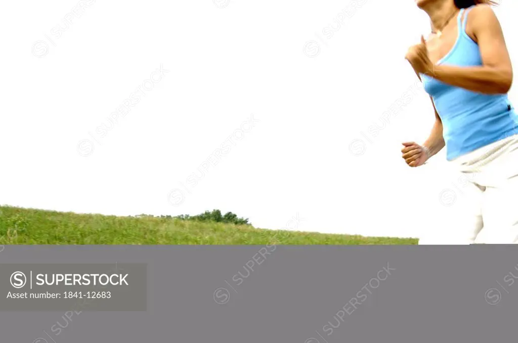 Woman jogging in field