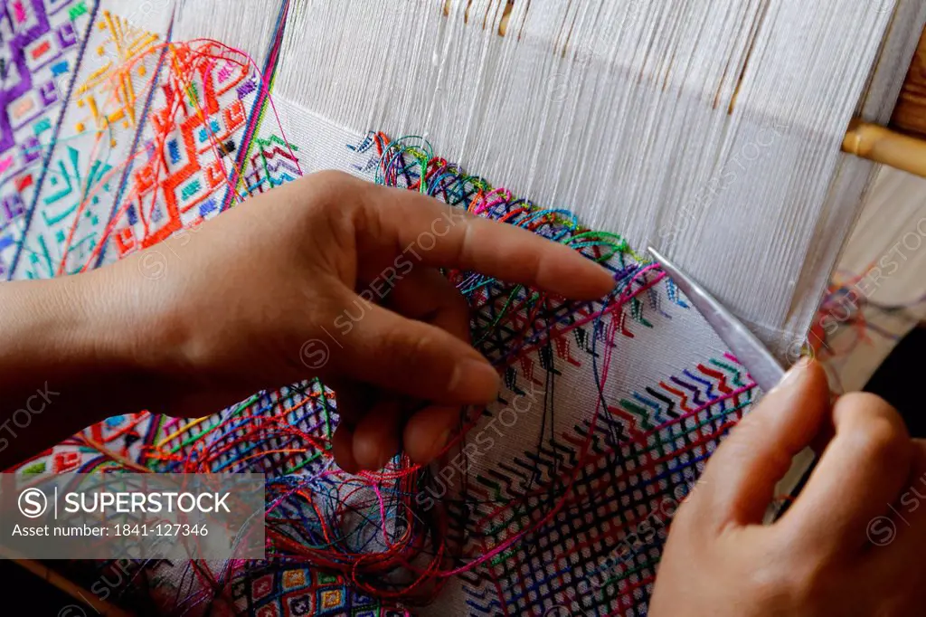 Woman sitting at weaving frame, Bhutan, Asia