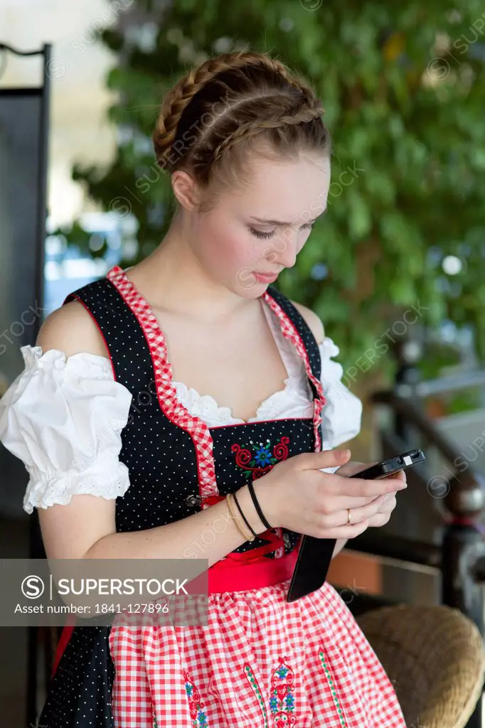 Teenage girl wearing dirndl, Lichtenau, Baden-Wuerttemberg, Germany, Europe