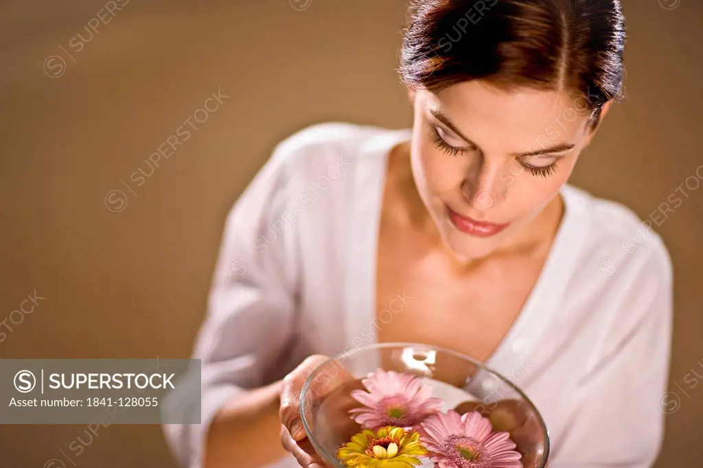 Young Woman Holding a Bowl with Blossoms