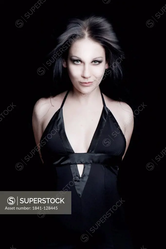 Dark-haired woman in black dress