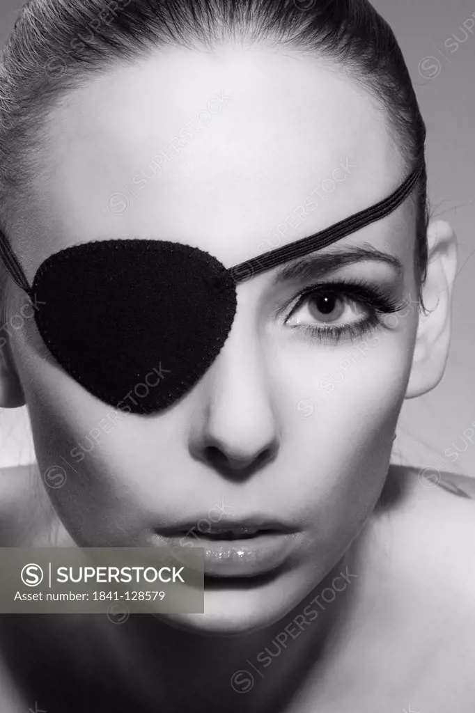 Young woman with eyepatch, portrait