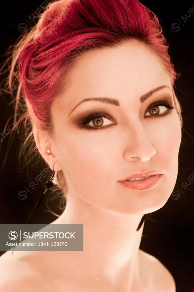 Attractive red-haired young woman, portrait