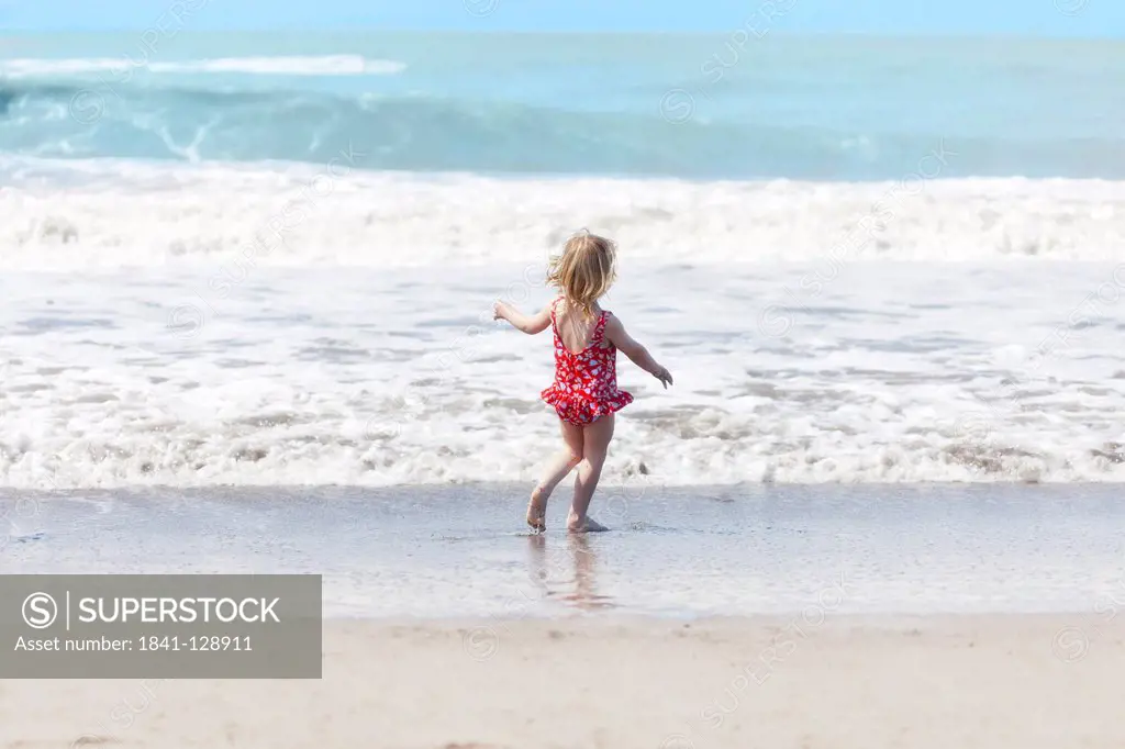 Girl with bathing costume at beach