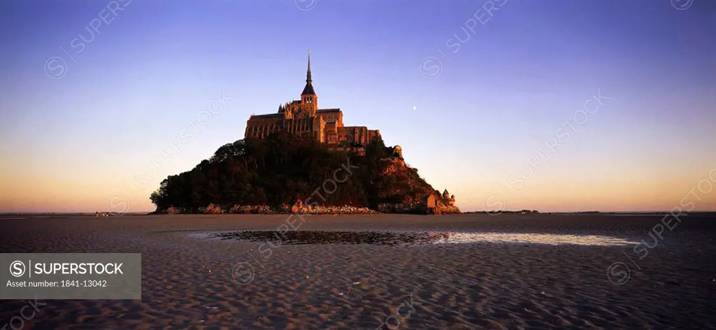 Cathedral on island at dusk, Mont Saint_Michel, Normandy, France