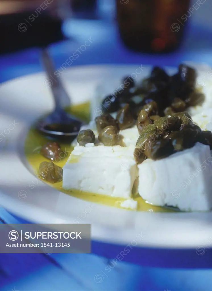 Close_up of goat cheese with olive oil