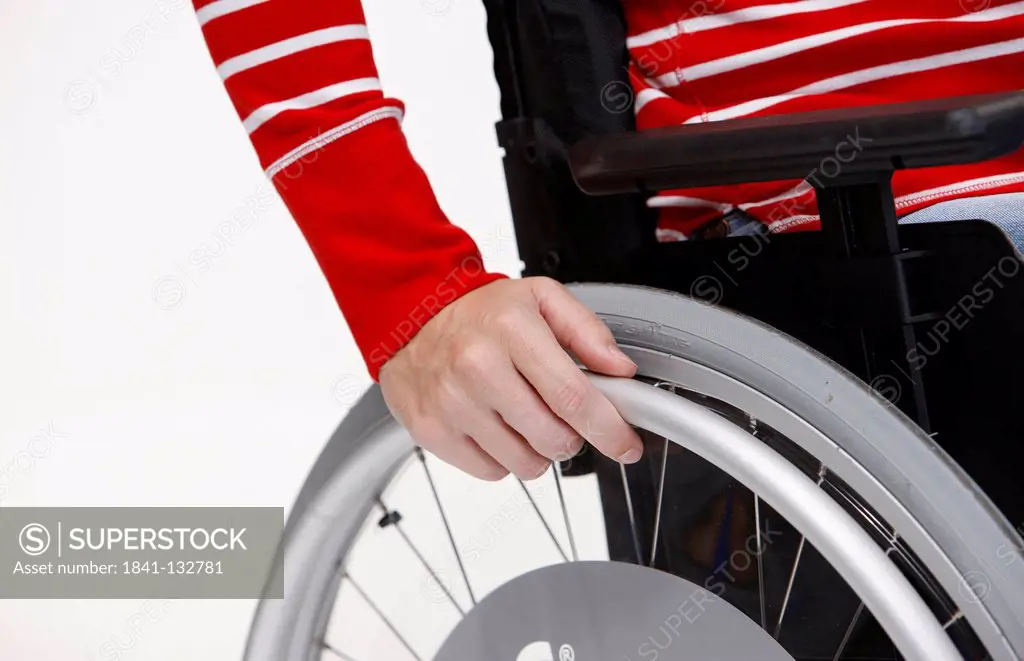 Detail shot of a woman in a wheelchair.