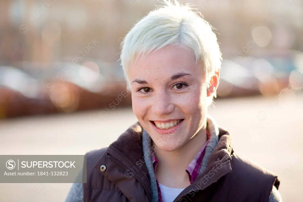Portrait of blonde short-haired young woman.