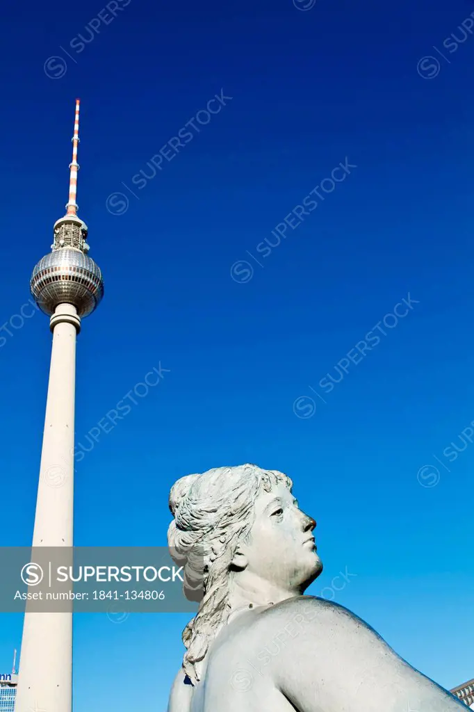 Statue of Neptune Fountain and television tower Alex, Germany, Europe
