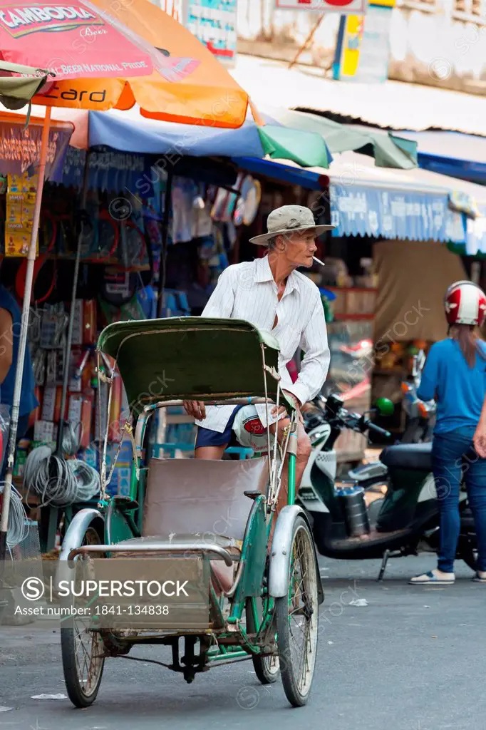 Man on a cycle rickshaw, Phnom Penh, Cambodia, Asia