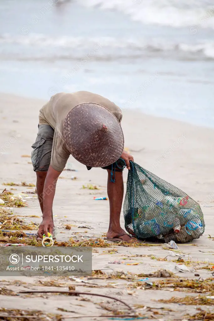 Garbage Collector on Kuta Beach in Bali, Indonesia