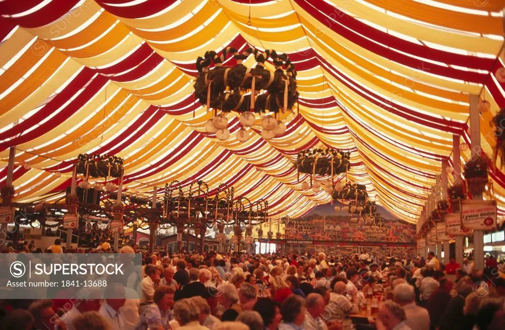 Crowd of people inside beer tent, Stuttgart, Germany