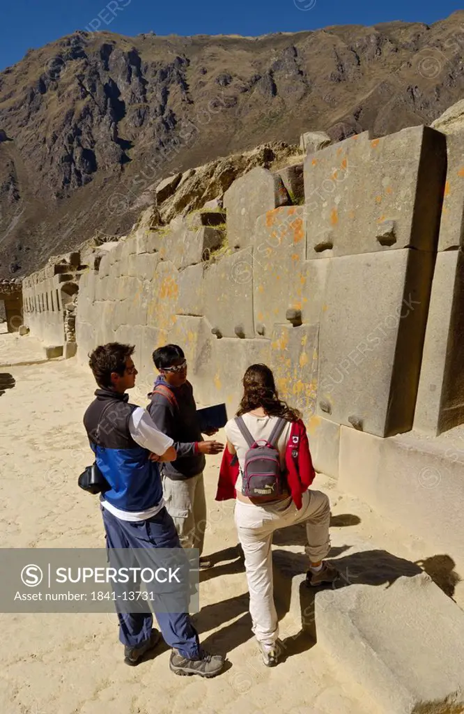Tourists watching old ruins, Ollantaytambo, Urubamba Province, Cusco Region, Peru
