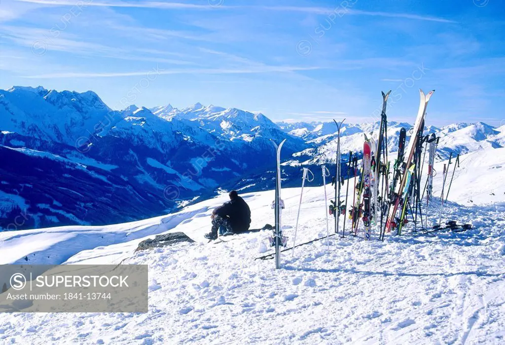 Skier resting ion snow covered hill, Koenigsleiten, Austria