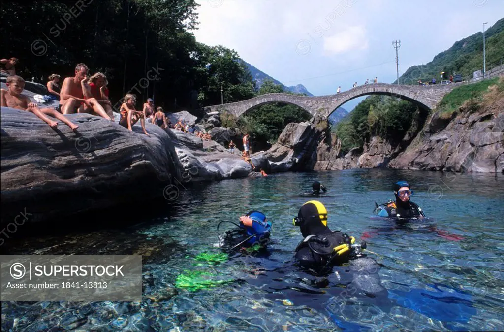 Scuba divers in river, Lavertezzo, Valle Verzasca, Locarno, Canton Of Ticino, Switzerland