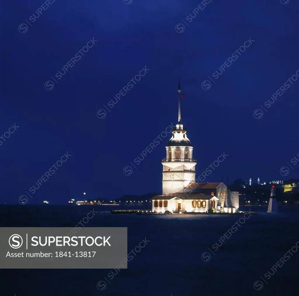 Building at waterfront lit up at night, Istanbul, Turkey