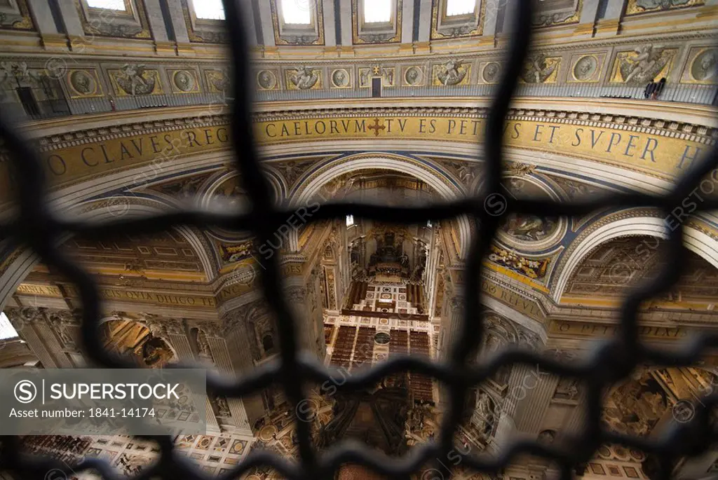 View through grid to the internal space of St. Peters Basilica, Rome, Vatican City, elevated view