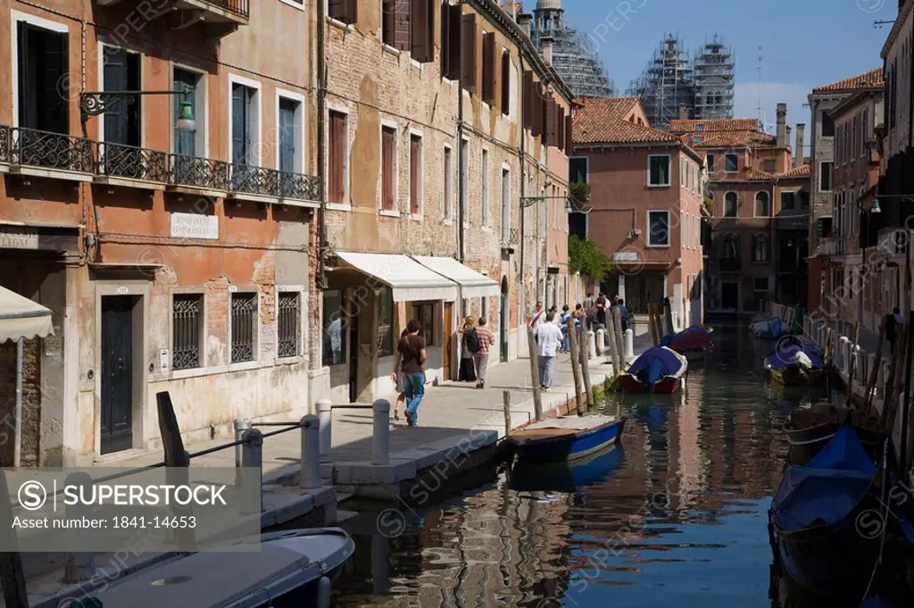 Tourists walking along canal, Veneto, Venice, Italy