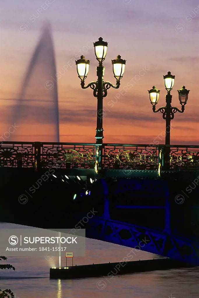 Lit up lampposts on bridge during dusk, Arch Bridge, Belgium