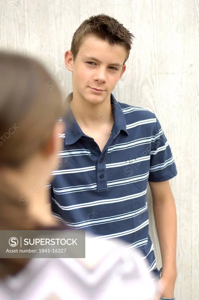 Teenage boy looking at his friend