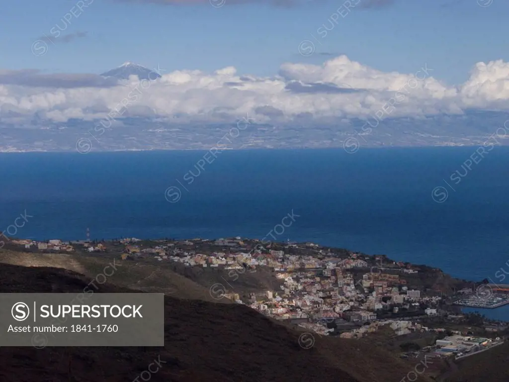 Clouds over town at coast, Tenerife, Canary Islands, Spain