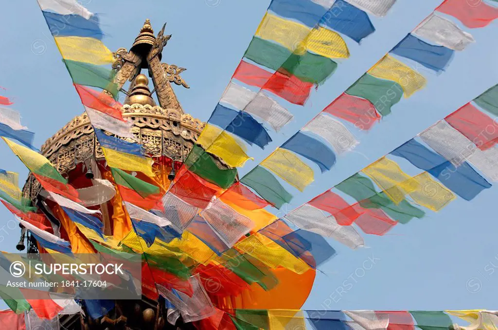 Low angle view of prayer flags and temple