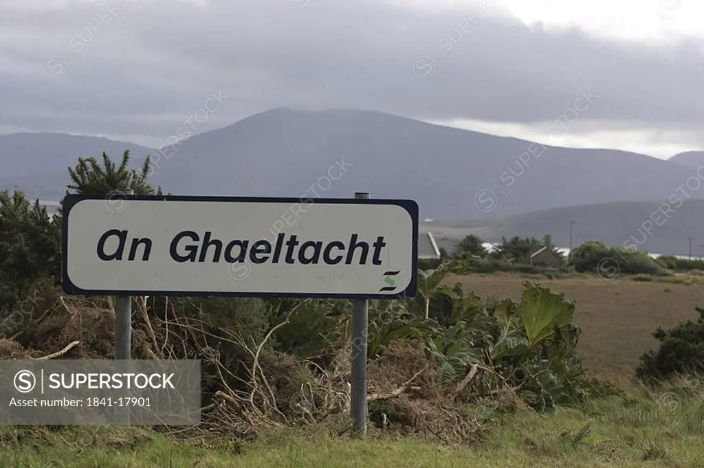 Signboard on rural landscape under overcast sky, Achill Island, County Mayo, Ireland