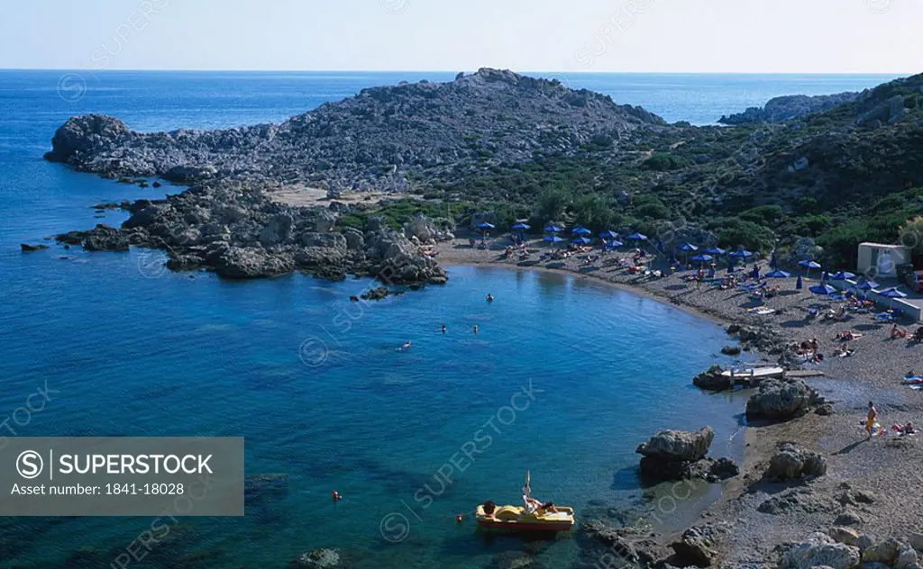 Aerial view of tourists on beach, Faliraki, Greece