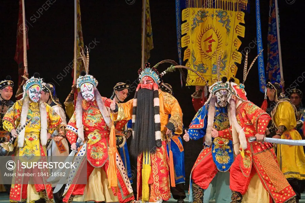 Group of stage performers performing in theater, Beijing, China