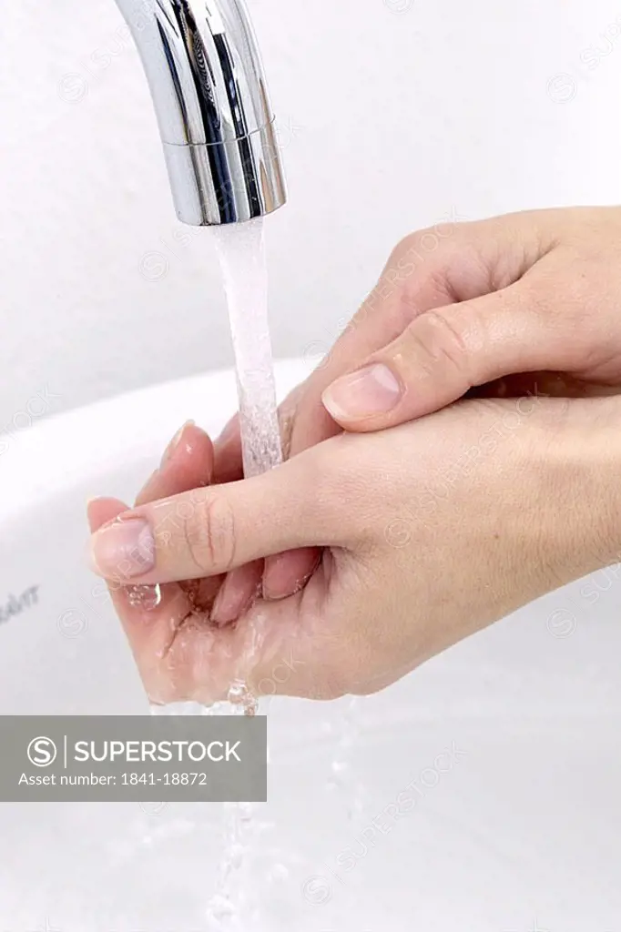 Close_up of woman washing her hands