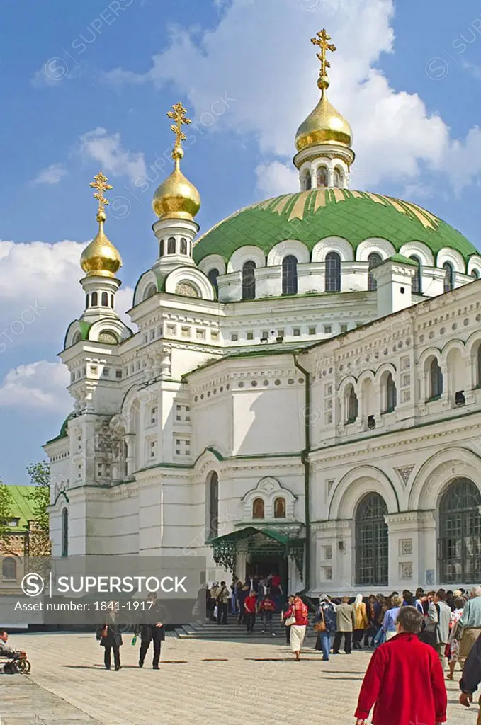 Tourists in front of monastery, The Refectory church of St. Anthony and Theodosius, Ukraine