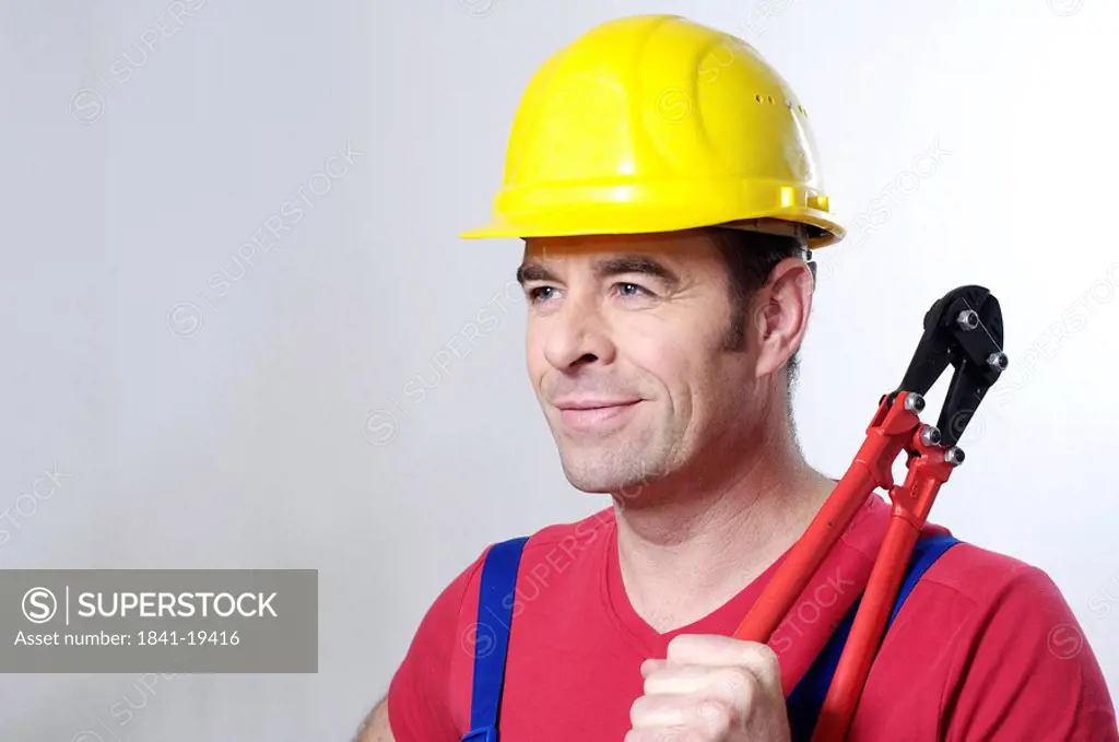 Close_up of man holding pliers