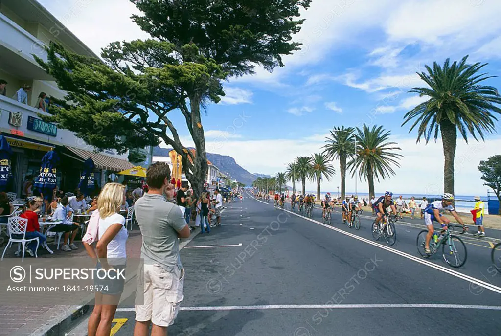 Couple watching bicycle race, Cape Argus Cycle Race, Cape Town, Western Cape Province, South Africa
