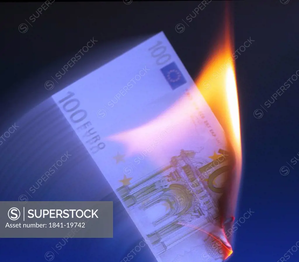 Close_up of burning one hundred euro banknote