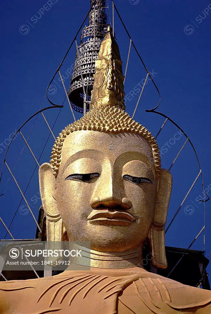 Low angle view of Buddha statue, Golden Temple, Wat Phra Kaeo, Bangkok, Thailand