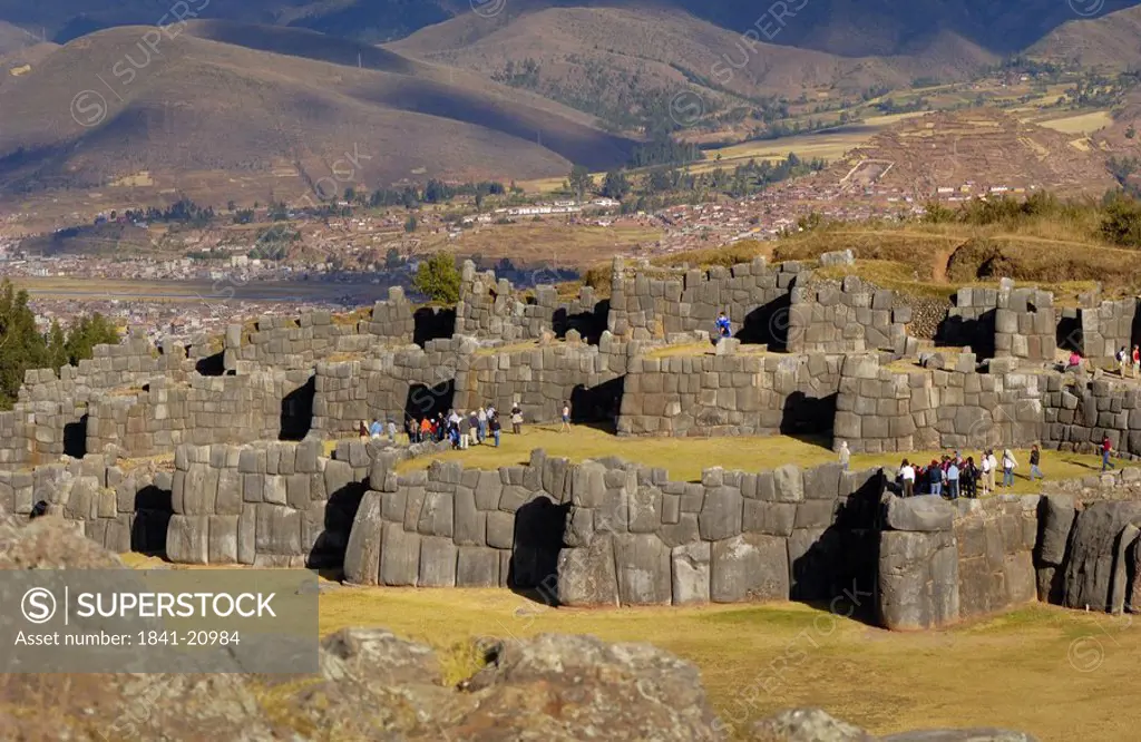 Tourists watching old ruins of fortress, Sacsayhuaman, Cuzco, Cusco Region, Peru