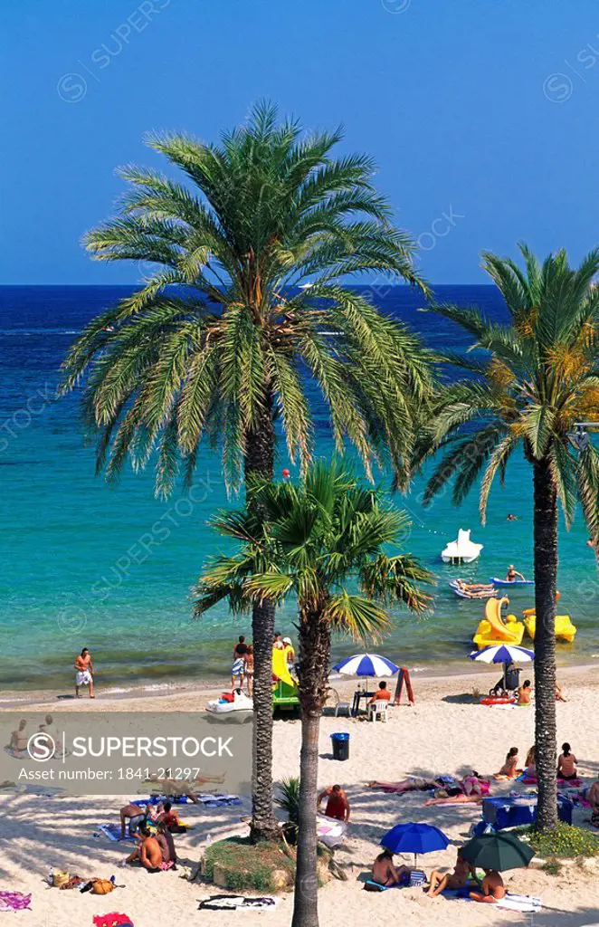 Tourists on beach, Platja d´en Bossa, Ibiza, Balearic Islands, Spain