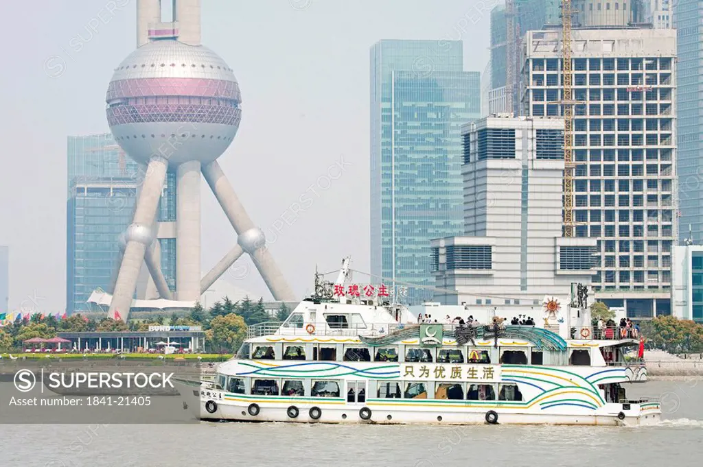 Ferry on a river, Skyscrapers in the background, Shanghai, China