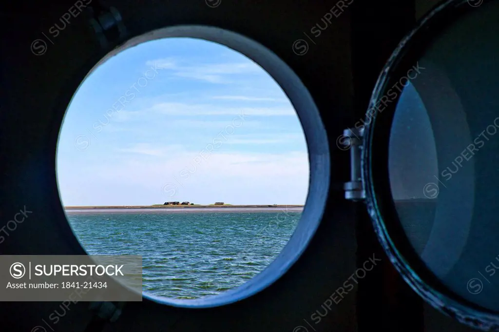 North Frisian Island seen from a porthole, Nordfriesland, Schleswig_Holstein, Germany