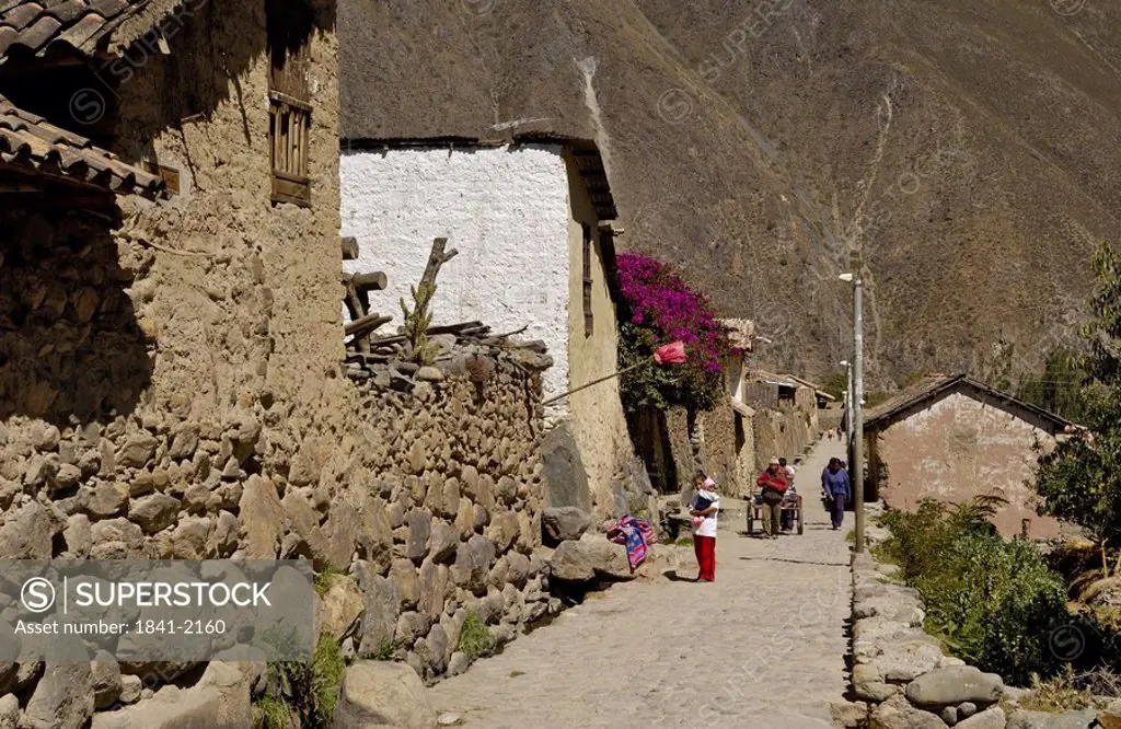 Tourists in village, Ollantaytambo, Urubamba Province, Cusco Region, Peru