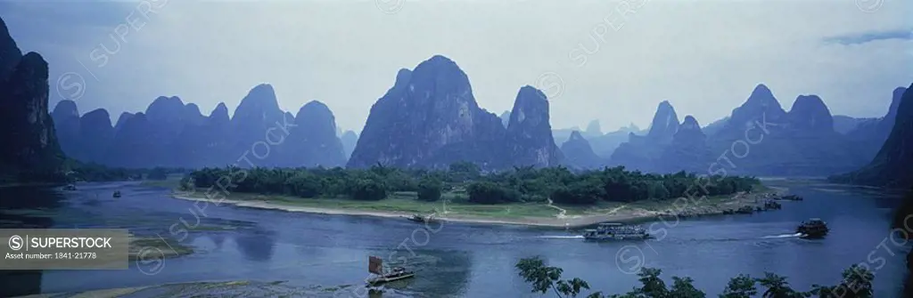 River with hill range in background, Li River, Guilin Hills, Guangxi Zhuangzu, China