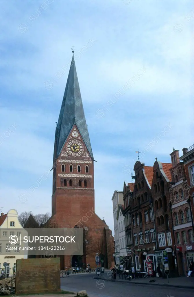 Clock tower against blue sky, St. John´s Church, Lunenburg, Lower Saxony, Germany