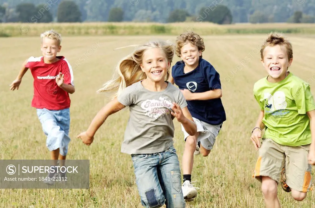 Children running over field
