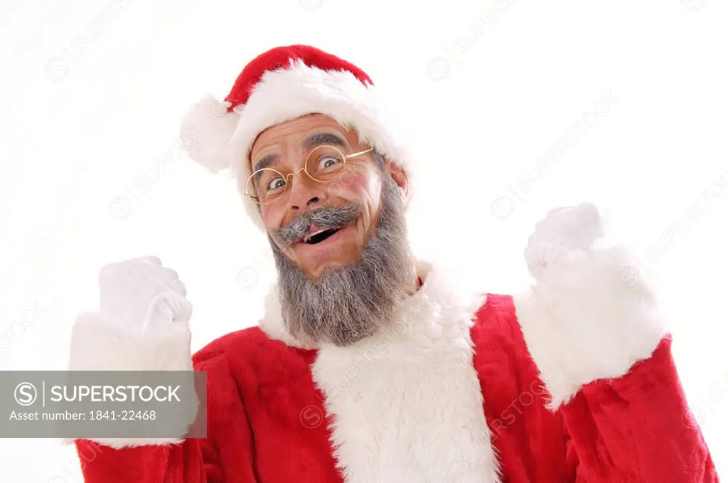 Portrait of senior man in santa costume looking happy