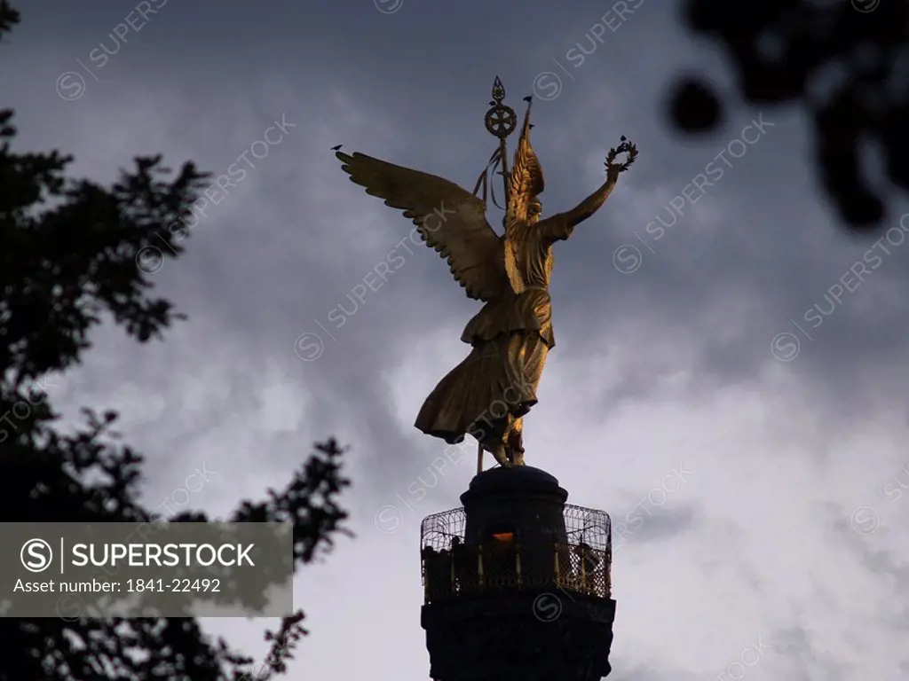 Silhouette of statue of angel on column at dusk, Victory Column, Tiergarten Berlin, Berlin, Germany