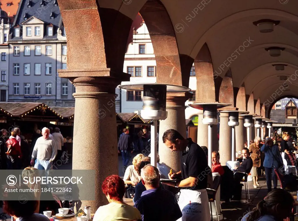 Group of people sitting at sidewalk cafe, Saxonia, Germany, Europe